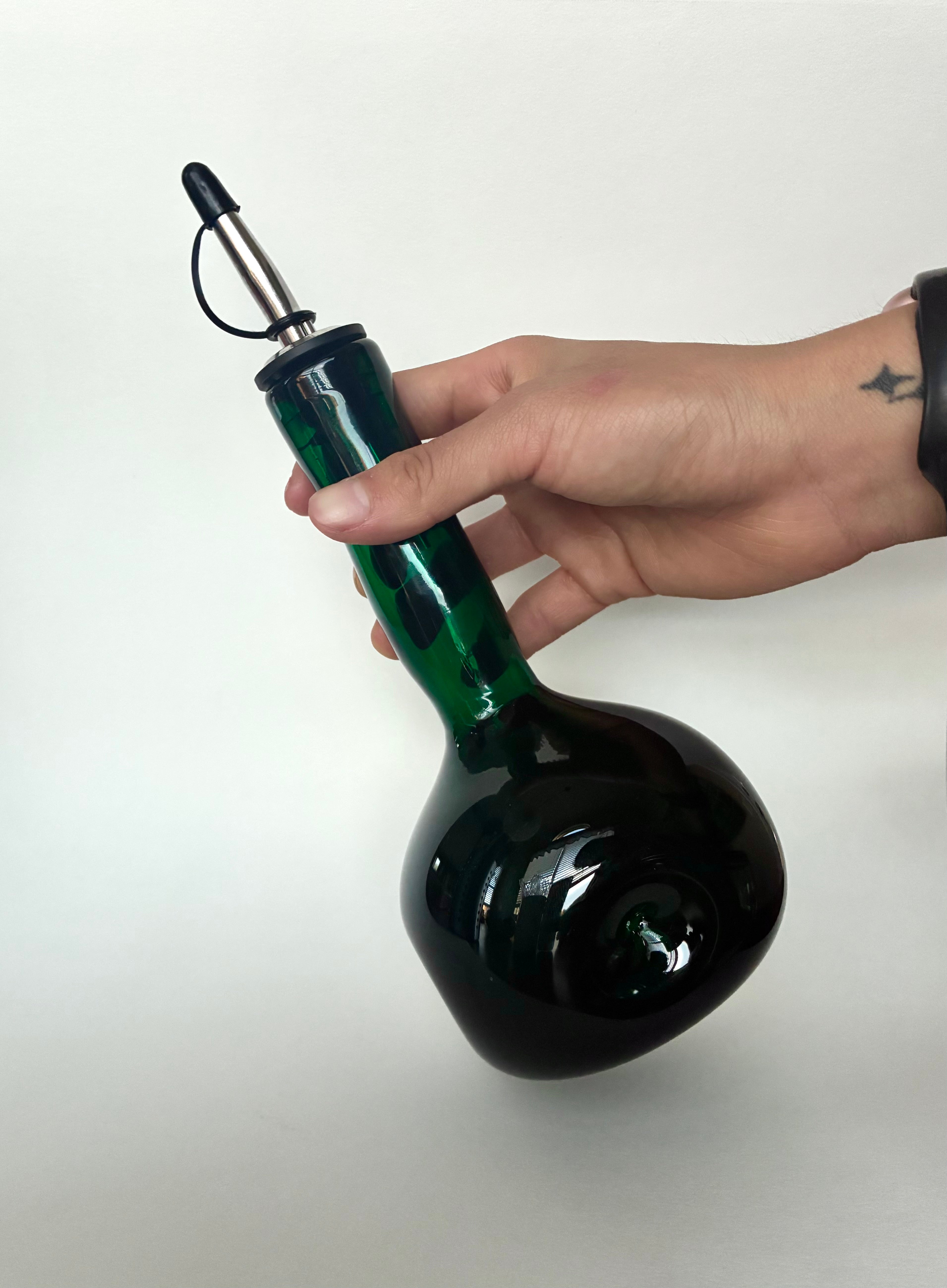 Emerald dimpled oil bottle